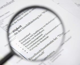 Magnifying glass spotting illegal investment scams