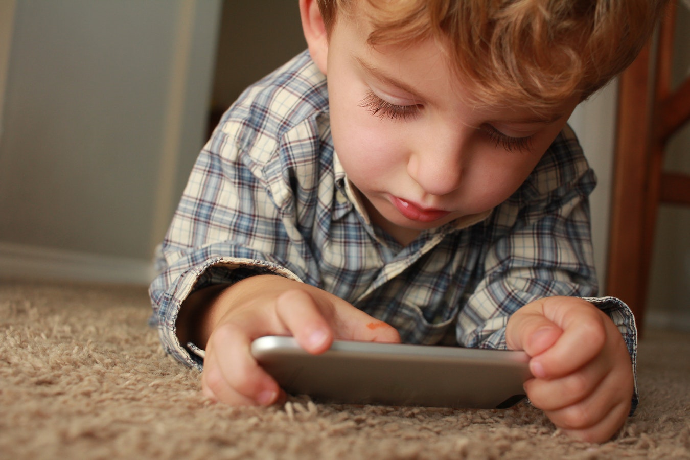 child playing with android apps from google family store